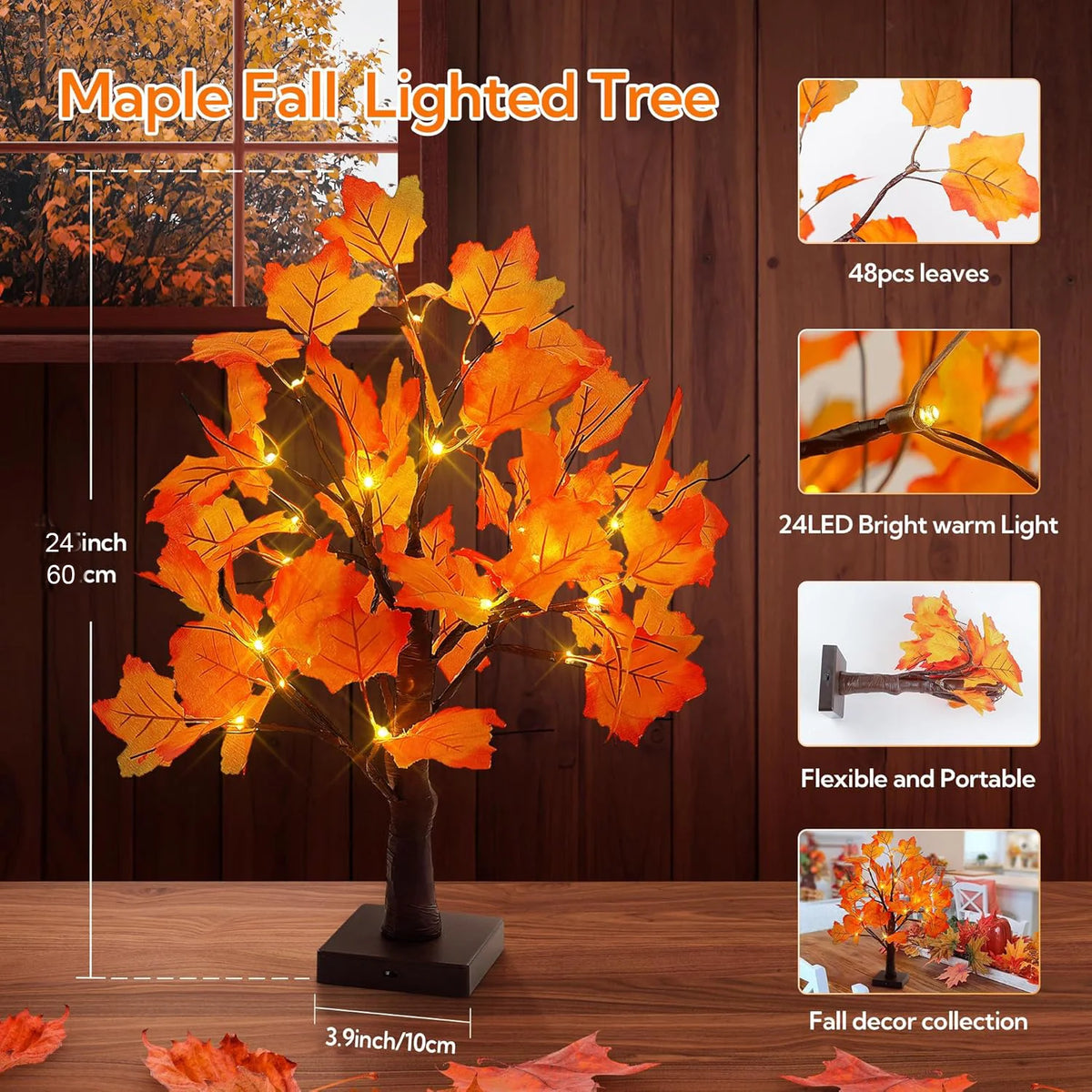 A lighted maple tree decoration with orange leaves displayed on a wooden surface.