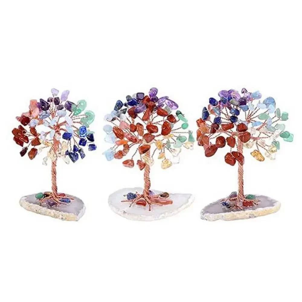A decorative crystal money tree featuring colorful, translucent crystals on a natural base.