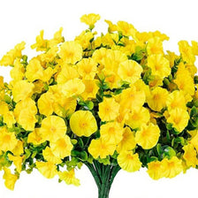 A bouquet of bright yellow artificial morning glory flowers with green eucalyptus stems.