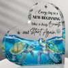 Acrylic tabletop decor featuring a blue sea turtle swimming underwater with text encouraging a new beginning.