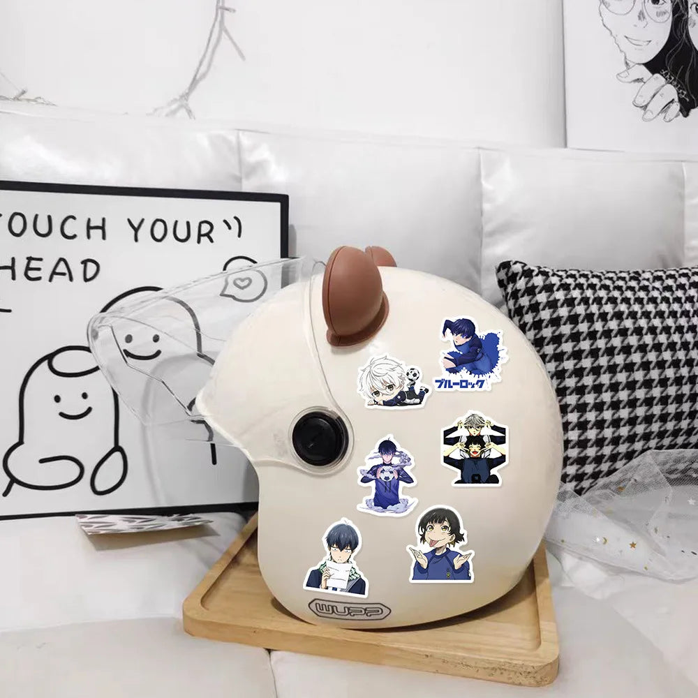 A white cartoon graffiti sticker pack for water bottles and luggage displayed on a wooden tray.