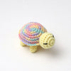 Handmade crocheted turtle plush with multicolored shell and yellow body