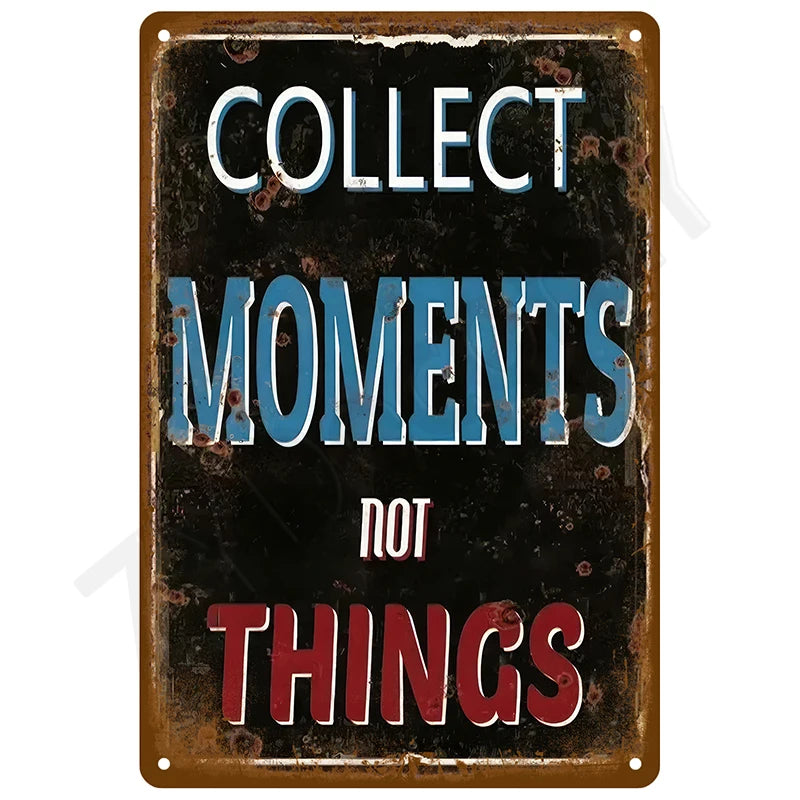 A vintage tin sign with distressed paint that reads COLLECT MOMENTS NOT THINGS