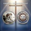 A silver commemorative coin featuring the name Yahweh and a cross design surrounded by a crown of thorns.