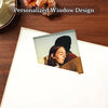 A personalized window design featuring a portrait of a woman in a dark hat and red clothing on a scrapbook page.