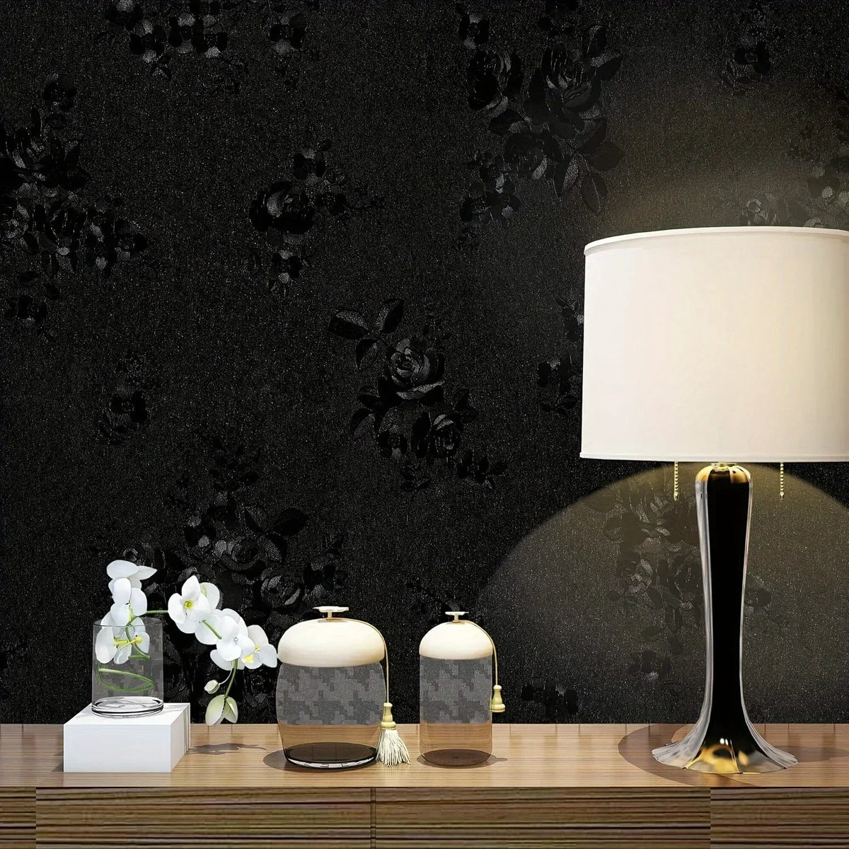A black floral self-adhesive contact paper is displayed on a wooden surface next to a white lamp.