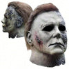 A realistic horror mask of Michael Myers with gray skin and bloodstains, shown in profile and frontal views.