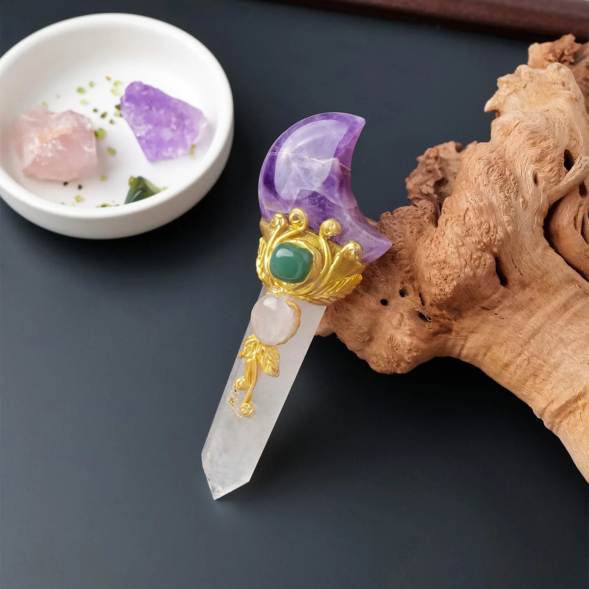 A natural crystal moon and star scepter wand featuring purple amethyst and pink quartz set against a dark background.