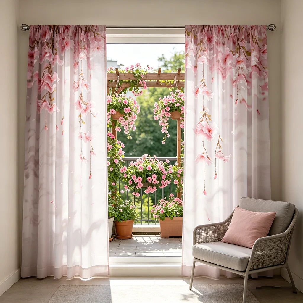 Light pink sheer curtains with cherry blossom floral accents hanging in a window frame.