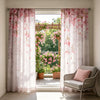 Light pink sheer curtains with cherry blossom floral accents framing a window.