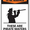 A black silhouette of a pirate with a cutlass is shown on an orange sign that reads YE BE WARNED THESE ARE PIRATE WATERS