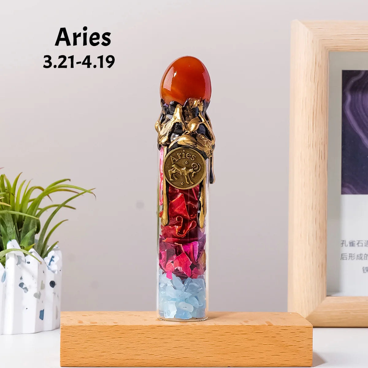 A natural crystal zodiac wishing bottle featuring raw healing stones and an amber top, displayed on a wooden surface.