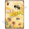 A vintage metal sign featuring a bee and sunflowers with the text BEE HAPPY on an orange background.
