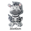 A foil balloon shaped like a zebra head with black and white stripes and pink accents.