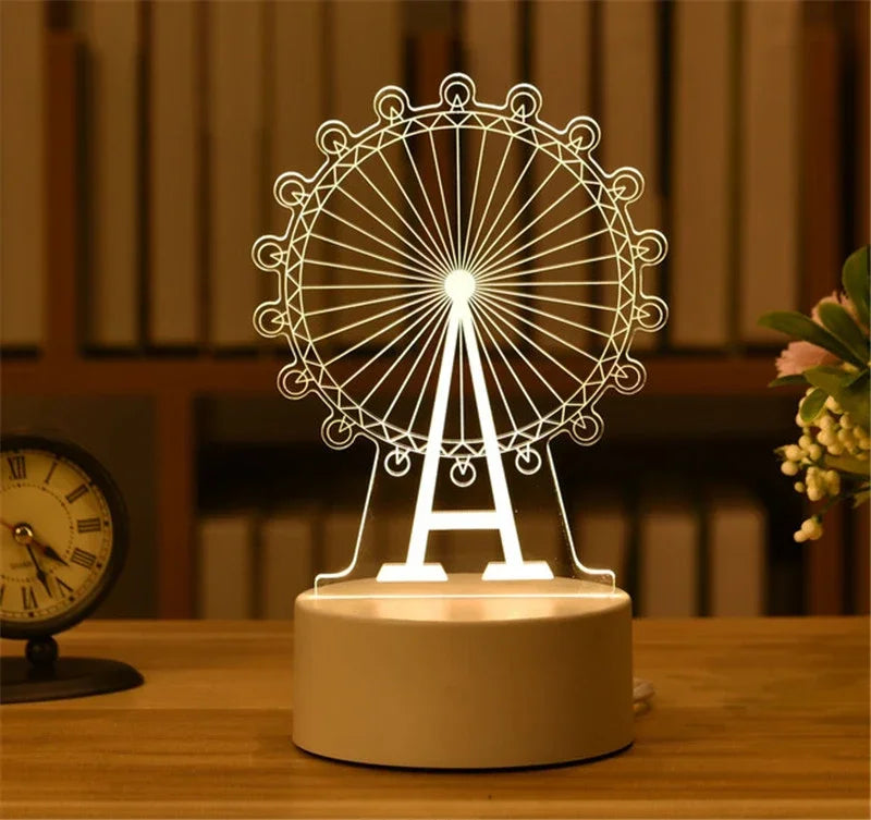 A white acrylic LED night light shaped like the Eiffel Tower is displayed on a wooden surface.