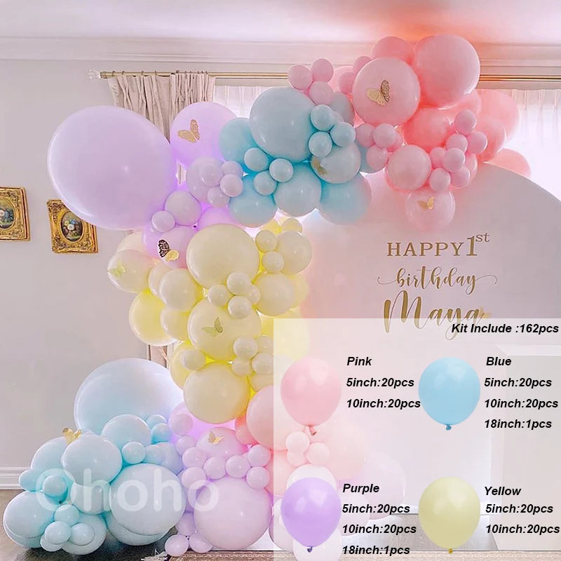 A colorful balloon garland kit featuring pink, blue, and yellow balloons arranged for a birthday decoration.