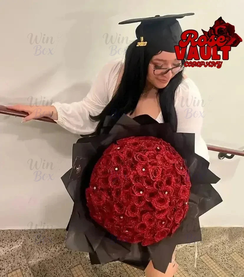 A person is holding a large bouquet of artificial red roses, displayed against a white background.