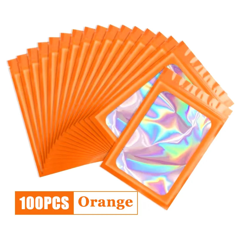 A fan of orange holographic ziplock bags for jewelry and small item storage