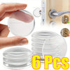 Six clear silicone adhesive door stoppers or bumpers shown next to a door handle and a hand.