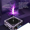 A small electronic device emitting purple plasma sparks, used to play square wave music through sound cables.