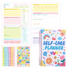 A colorful self-care planner journal with daily tracking pages and decorative stickers for happiness.