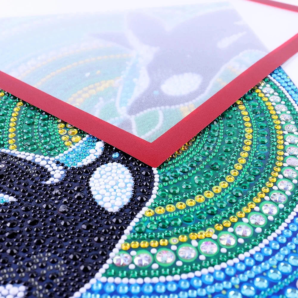 Close-up of a magnetic poster display frame featuring intricate green and blue beadwork designs.