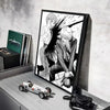 Anime wall art featuring a character in a dark suit and white hair against a black background.