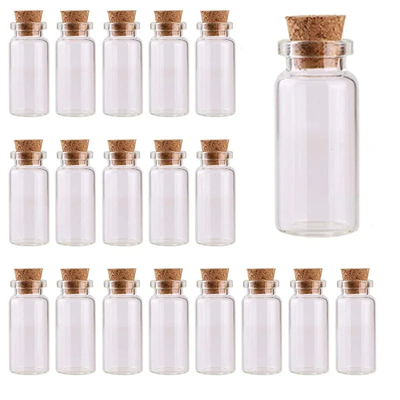 A collection of clear glass bottles with cork stoppers for DIY decor.