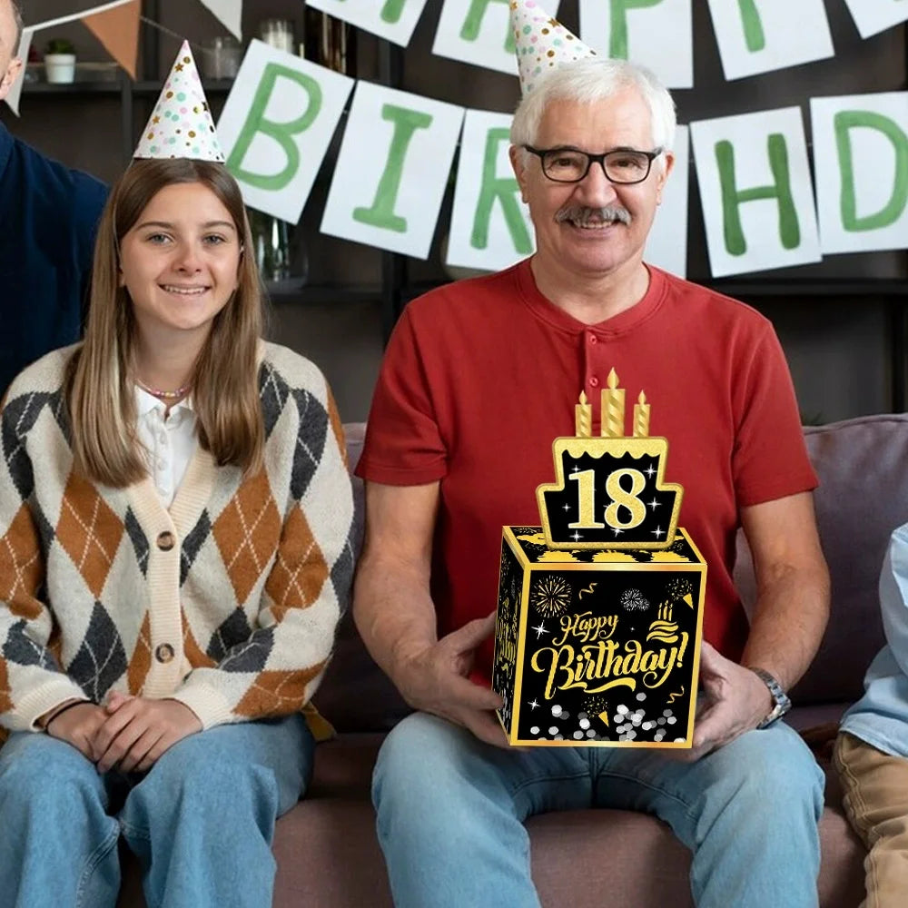 A man and a girl smiling while holding a birthday money gift box with DIY stickers.