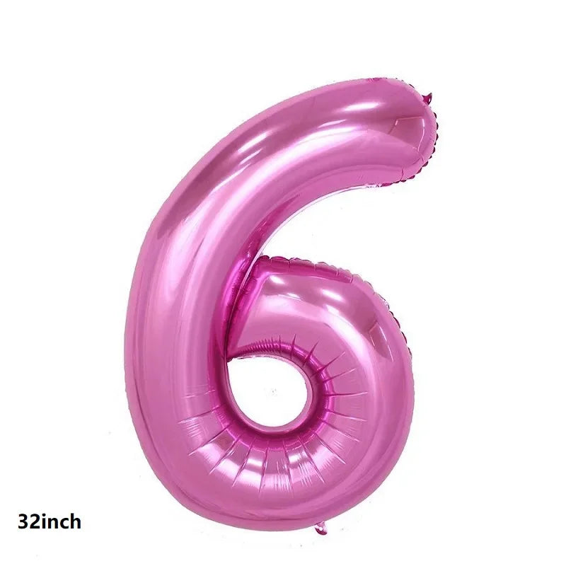 A single pink latex balloon shaped like the number six