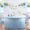Light blue stretch spandex round tablecloth with pleats set for a party or event.