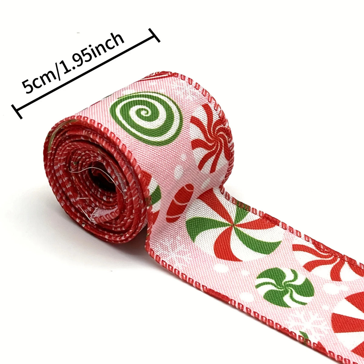 Red and green candy cane patterned burlap ribbon rolled and unwound, showing a spiral design.