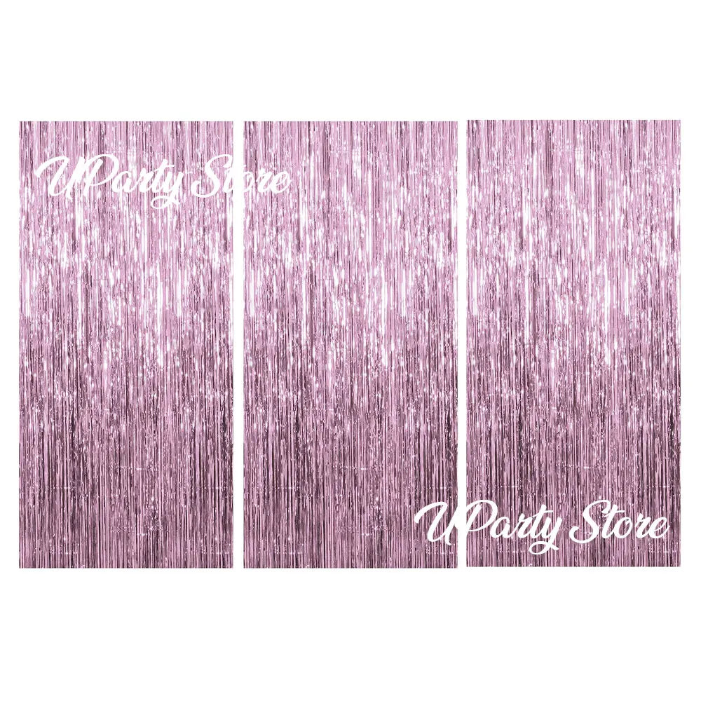 Three vertical panels of metallic fringe curtains in a dusty rose color for party backdrop decor