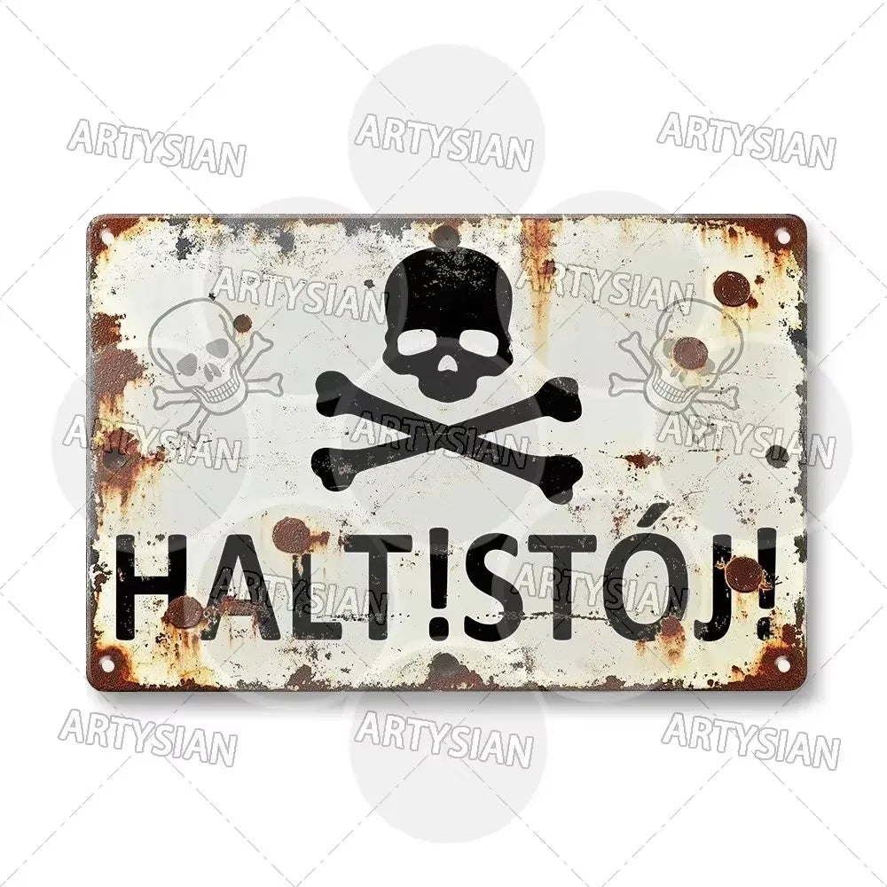 A distressed, rusty metal sign featuring a skull and crossbones symbol and the text HALT!STÓJ!