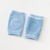 Light blue knitted knee pads for crawling infants