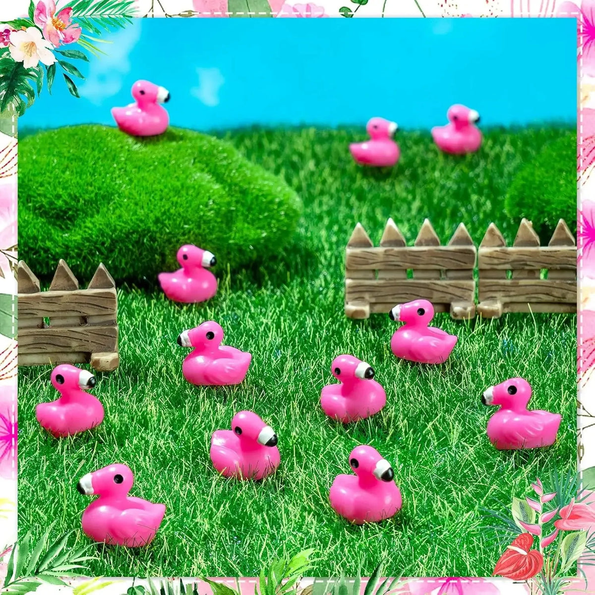 A collection of pink miniature resin flamingo duck figurines scattered across vibrant green grass.
