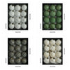 A set of twelve green, spherical retro shatterproof Christmas tree ball ornaments displayed in a black box.
