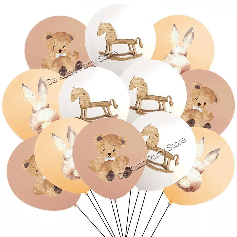 A collection of round balloons featuring cute teddy bears and wooden horses for a gender reveal banner garland.