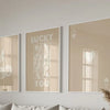 Three framed art prints featuring the words lucky you and a heart design in sepia tones