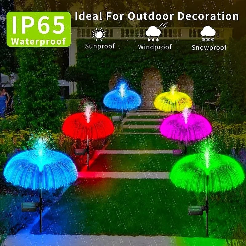 Colorful jellyfish garden lights illuminating a pathway with various colors like blue, red, yellow, and green.