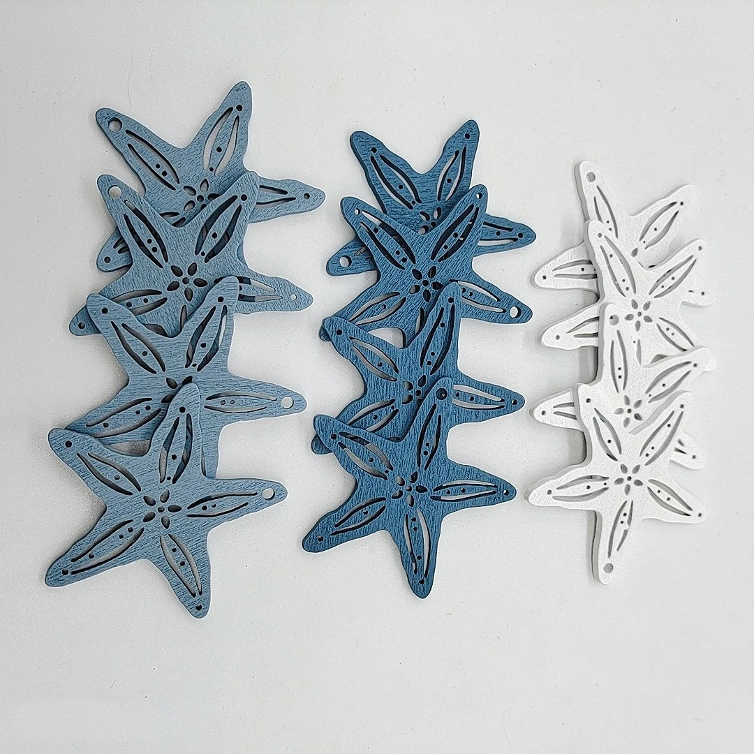 A set of twelve wooden ocean ornaments featuring starfish, scallops, and other sea creatures in blue and white.