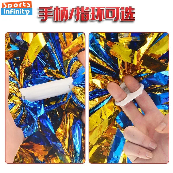 A hand is shown holding a white pom pom with a comfortable handle against a background of shiny blue and gold foil.