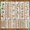 A set of reusable floral alphabet stencils cut from wood showing various decorative patterns for painting and decals.