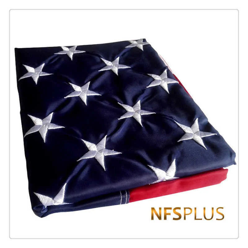 Navy blue fabric featuring a star pattern embroidered on the surface with red trim.