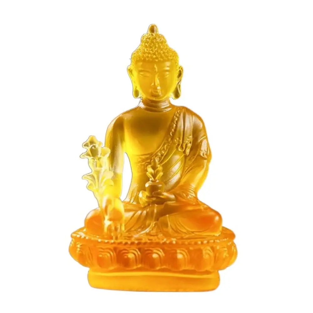 Golden resin statue of Medicine Buddha seated in meditation on a lotus base