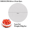Silver coated round cake board with strawberries shown next to the product packaging details