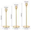 A set of three elegant gold-toned metal candle holders with varying heights and bases.