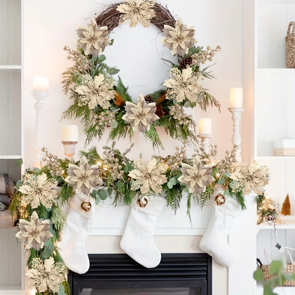A wreath of dried flowers and greenery hangs above a white fireplace mantel decorated with white socks.