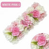A floral arrangement of white and pink silk roses and hydrangeas used for weddings and events.