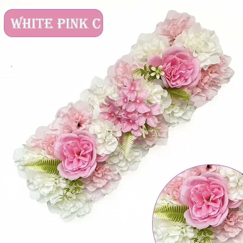 A floral arrangement of white and pink silk roses and hydrangeas used for weddings and events.